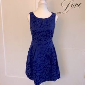 Royal blue dress with full skirt and floral embroidery detail